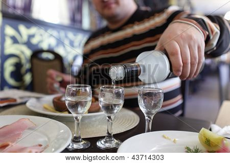 Man Buttles Vodka In A Pub