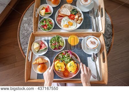 Top View Of Woman Hands Take Fork And Knife, Prepare To Eating Her Breakfast In Hotel. Room Service 