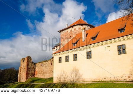 Bauska, Latvia - October 23, 2021: Historic Bauska Castle In Latvia Up In The Hill In Sunny Autumn D