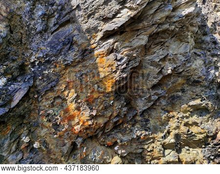 Geodesy. Stone Texture. The Rock Is Brown And Red. Mineral Background. Design From Natural Materials
