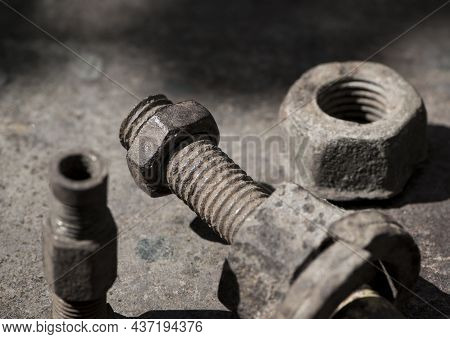 Rusty Nut. Rusty Iron Rod With Screw Threads. Rusted Mechanical Components. Threaded Bolt And Nut Is