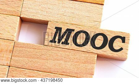 Mooc - Massive Open Online Course - Handwriting On Wooden Block, Business Concept.