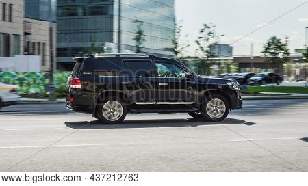 Fast Moving Toyota Land Cruiser 200 On The City Road. Compliance With Speed Limits On The Streets. S