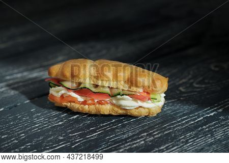 Snack Eclairs Profiteroles With Creamcheese, Cucumber And Smoked Salmon Red Fish. Tasty Appetizer On