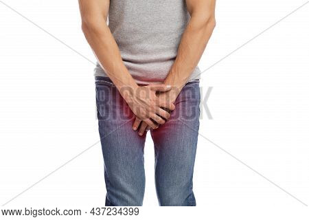 Unrecognizable Young European Guy Suffer From Crotch Pain, Presses Hands, Highlighted In Red