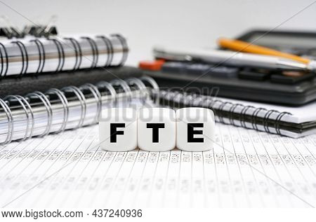 Business And Finance Concept. On The Table, Among Office Objects, Cubes With The Inscription - Fte