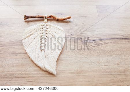 Macrame Leaf  In Natural Color On A Wooden Table. Cotton Rope Decor Macrame To Make Your Room More C