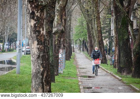 Pancevo, Serbia - April 18, 2021: Selective Blur On An Old Senior Man Wearing A Respiratory Face Mas