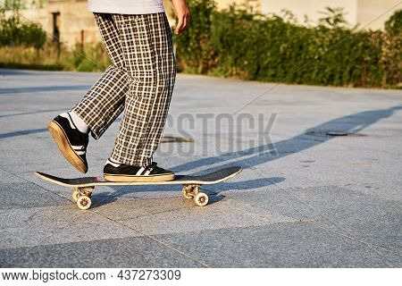 Skateboarder Ride On Skateboard At City Street. Scater Practice Skate Board Tricks At Skatepark. Tee