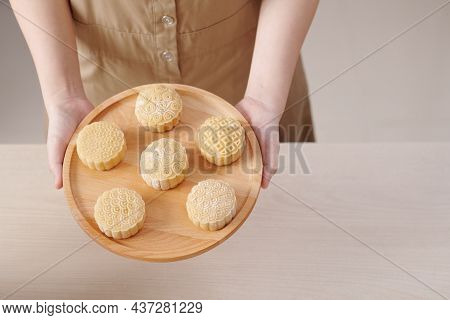 Set Of Beautiful Decorated Mooncakes On Wooden Tray Ready For Being Baked In Oven