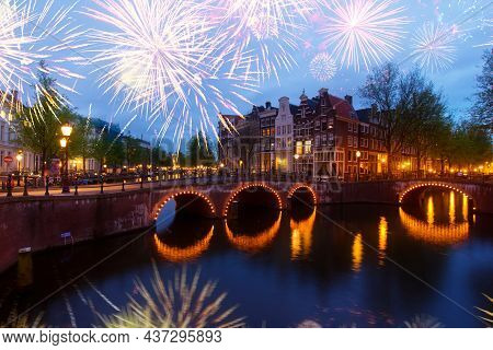 Famous Canals And Bridgres Of Amsterdam In Night With Fireworks, Netherlands