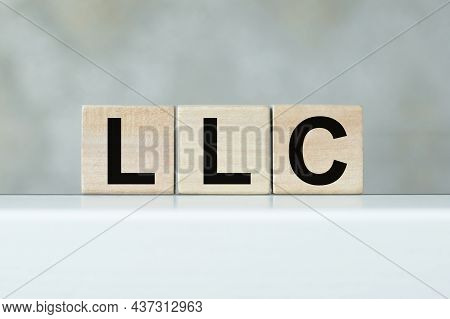 Llc Limited Liability Company Text On Wooden Cubes On The Table