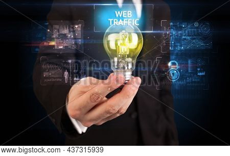 Businessman holding a light bulb, online security concept