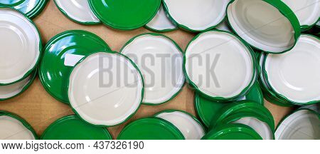 Green Metal Screw Caps Lie In The Box