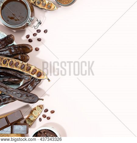 Organic Carob Pods, Powder And Carob Molasses On A Beige Background, Locust Bean Healthy Food, Cerat