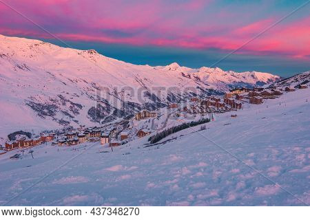 Picturesque Winter Sunrise Scenery, Stunning Ski Resort With Typical Alpine Wooden Houses On The Slo