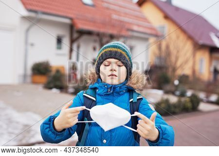 Kid Boy Wearing Ffp Medical Mask On The Way To School. Child Backpack Satchel. Schoolkid On Cold Aut