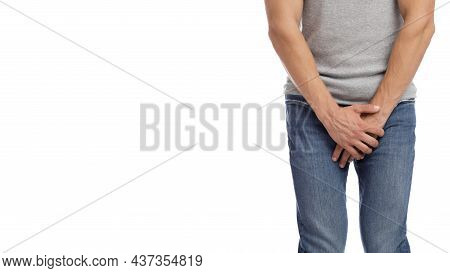 Cropped Millennial European Muscular Male Suffering From Groin Pain, Presses Hand To Crotch