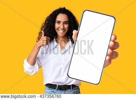 Cute Pretty Midde-eastern Woman Showing Mobile Phone With Empty Screen