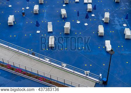 Sun Loungers Prepared For Tourists To Sunbathe On The Terrace Next To The Beach In A Coruna, Galaici