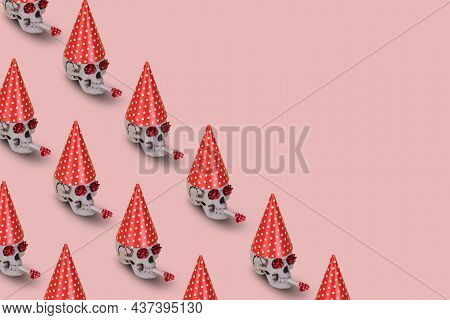 Pattern Of Human Skull  With A Red Birthday Cap And Whistle On A Pink Background. Minimal Holiday Ce