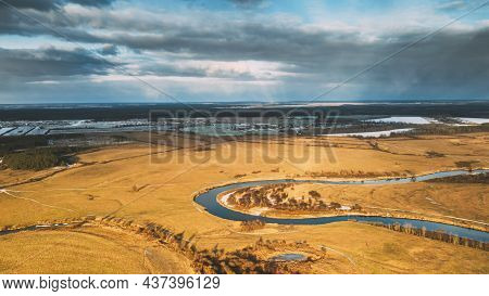 Aerial View Of Dry Meadow And Partly Frozen River Landscape In Sunny Autunn Day. Top View Of Beautif