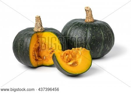 Fresh green whole Kabocha pumpkin and a cut close up isolated on white background