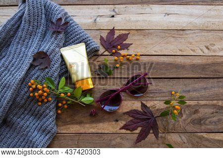 Sunscreen Spf50 Cosmetics Health Care For Skin Face With Sunglasses, Knitting Scarf And Meple Leaf O