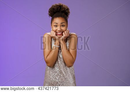 Silly Cute Charming Touched African-american Woman In Silver Dress Squeez Cheeks Smiling Impressed G