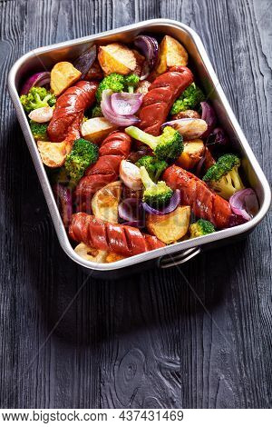 Sausage And Vegetable Traybake With Smoked Pork Sausage, Broccoli, Potato, Red Onion, Garlic On A Ba