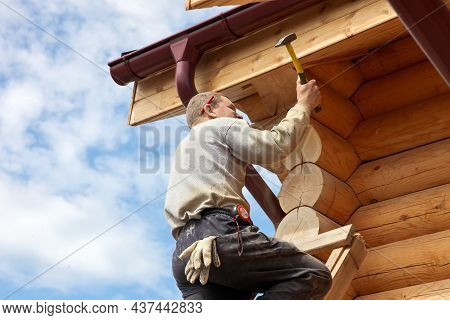 Tyumen, Tyumen Region, Russia - March, 14, 2013: Construction Of A Wooden House And A Roof With Tool