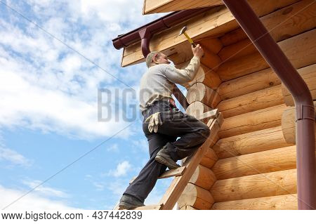 Tyumen, Tyumen Region, Russia - March, 14, 2013: Construction Of A Wooden House And A Roof With Tool