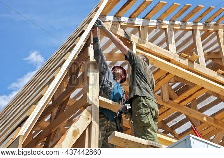 Tyumen, Tyumen Region, Russia - March, 14, 2013: Construction Of A Wooden House And A Roof With Tool