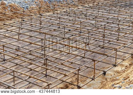 Pouring Cement Or Concrete With A Concrete Mixer Truck, Construction Site With A Reinforced Grillage