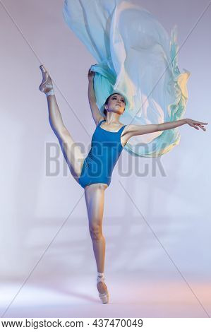 Ballet Ideas And Concepts. Young Japanese Female Ballet Dancer Dancing With Green Flying Cloth While