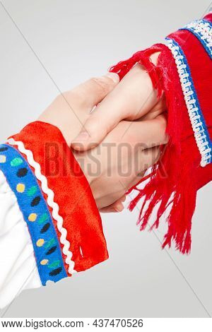 Caucasian Couple Connected Together In National Costumes Demonstrating Support And Encuragement Of T