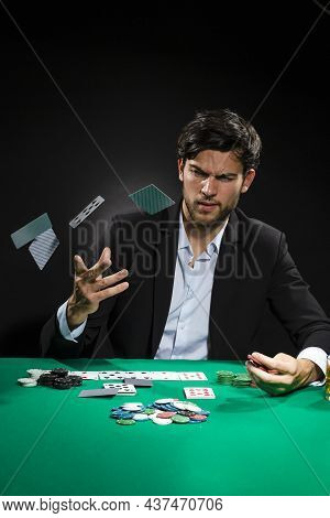 Casino Ideas And Concepts. Handsome Caucasian Young Pocker Player Staking And Betting To Win At Pock