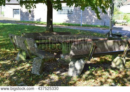 Stone  Table With Park Benches Around, Resting Area At A Hiking Trail