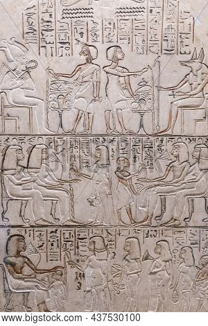 Egyptian Hieroglyphs And Ancient Drawings On Clay Tablets And Papyri Background. The Art Of Egypt An
