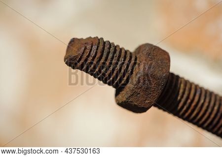 Old Rusty Bolt, Iron Rod With Screw Threads. Rusted Mechanical Components. Threaded Bolt And Nut Iso