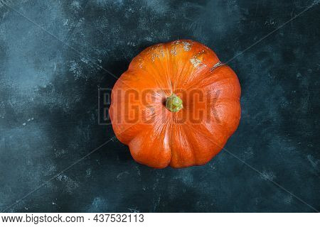 A Fresh Organic Ripe Potimarron Pumpkin Isolated On A Blue Background, Autumn And Harvesting Concept