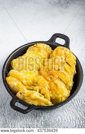 Baked Potato Gratin Dauphinois In A Pan. White Background. Top View