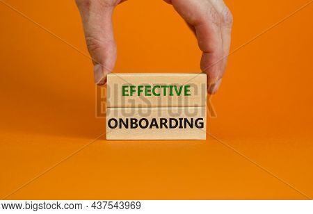 Effective Onboarding Symbol. Wooden Blocks With Words Effective Onboarding On Beautiful Orange Backg