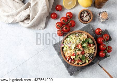 Salad With Bulgur, Tomatoes, Cucumbers And Parsley. Tabouleh Dish. Oriental Cuisine. Copy Space.