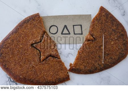 Kiev Ukraine - October 2021 Squid Game Invitation Card Star Shape Homemade Sugar Candy. Playing Kore
