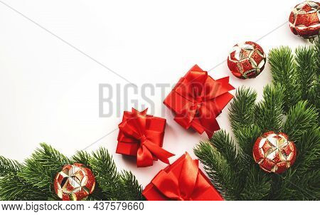 Christmas And New Year Background With Fir Branches, Red Gift Boxes, Christmas Balls, White Top View