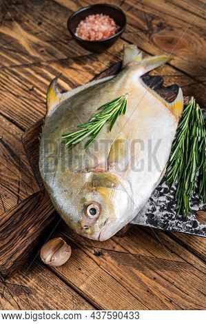 Raw Fish Sunfish Or Pompano On A Wooden Board. Wooden Background. Top View