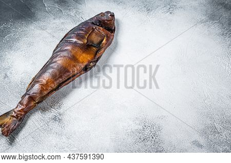 Hot Smoked Whole Fish On Kitchen Table. White Background. Top View. Copy Space