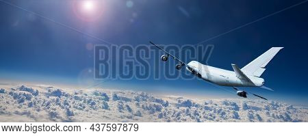 Tail View Of Big Civil Airplane Fly Over Clouds