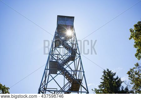 The Sun Shines Through The Red Hill Fire Tower In The Catskills Mountains, In Claryville, New York D